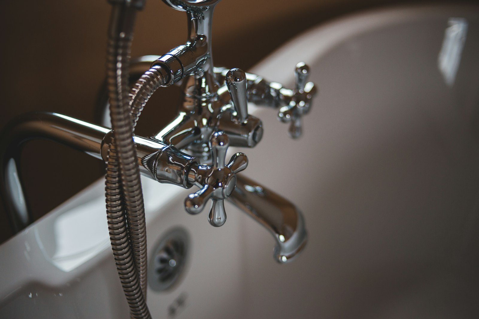 Plumber repairing a sink drain pipe